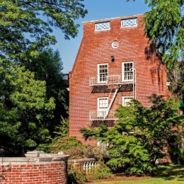 a brick building with trees