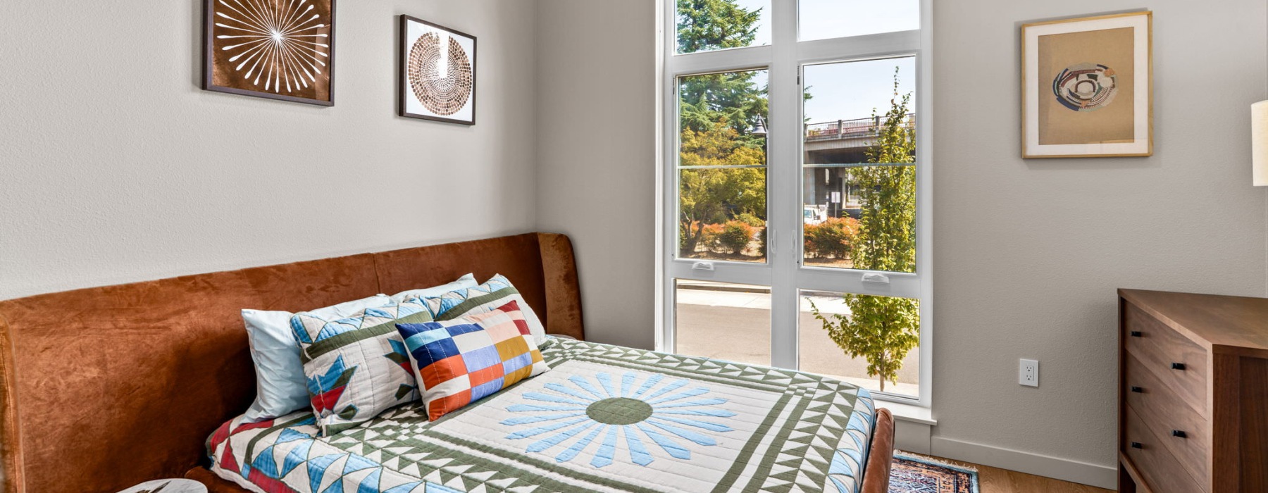 a bedroom with a bed and a window